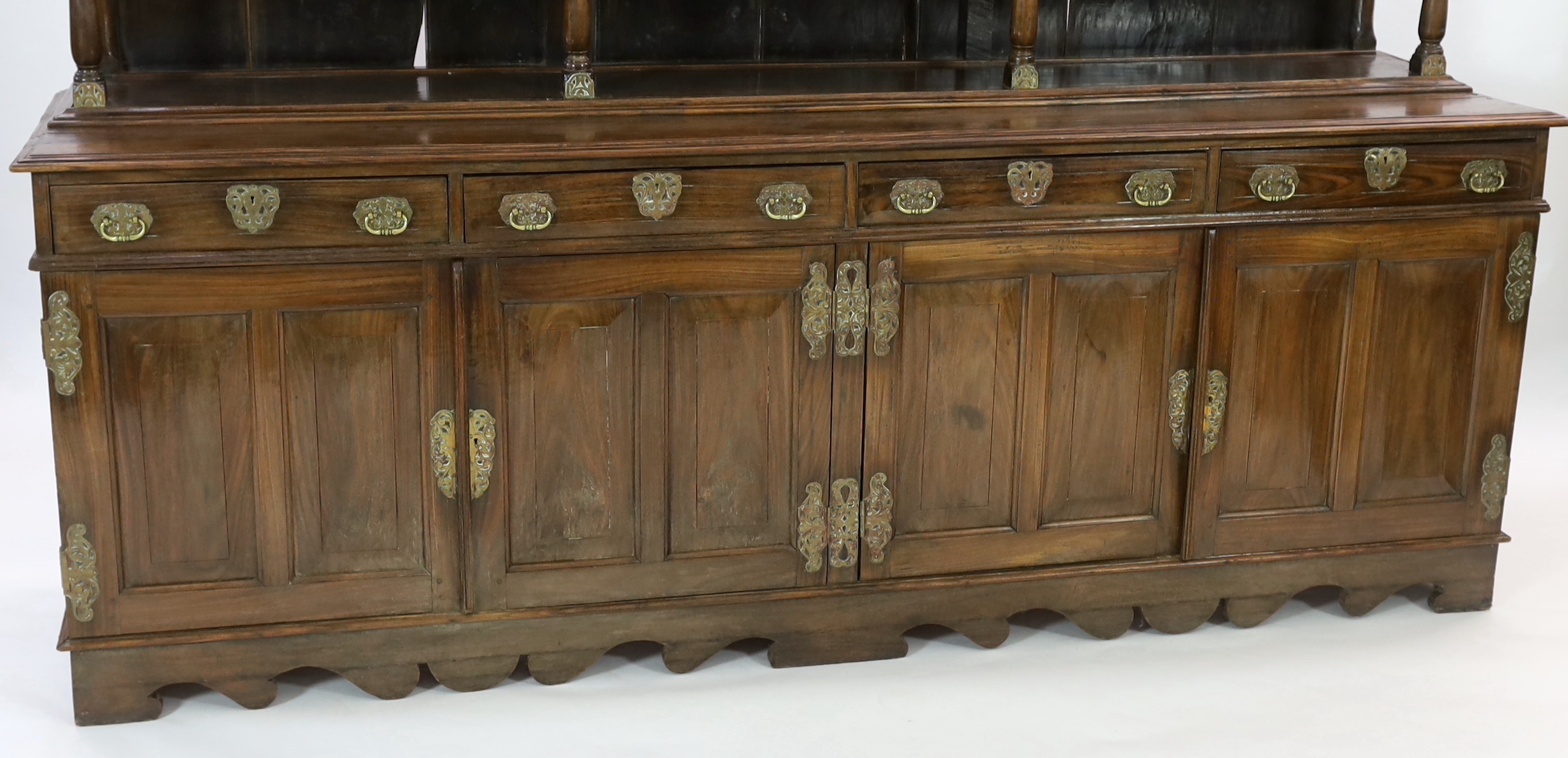 A rare Ceylonese Arts & Crafts brass mounted teak dresser